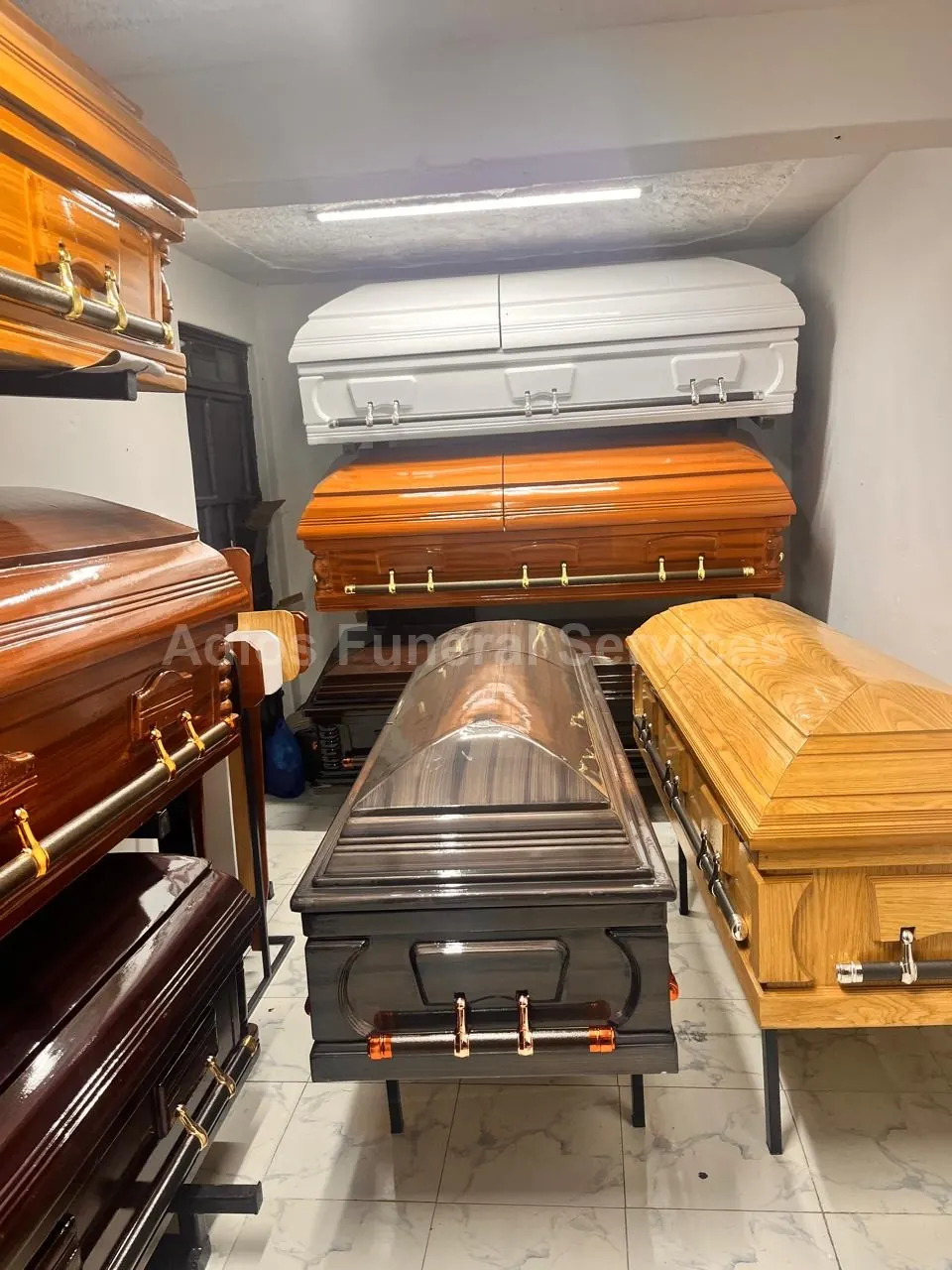 Coffins on display in the Adios showroom