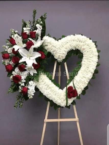 Heart-shaped floral tribute on a stand
