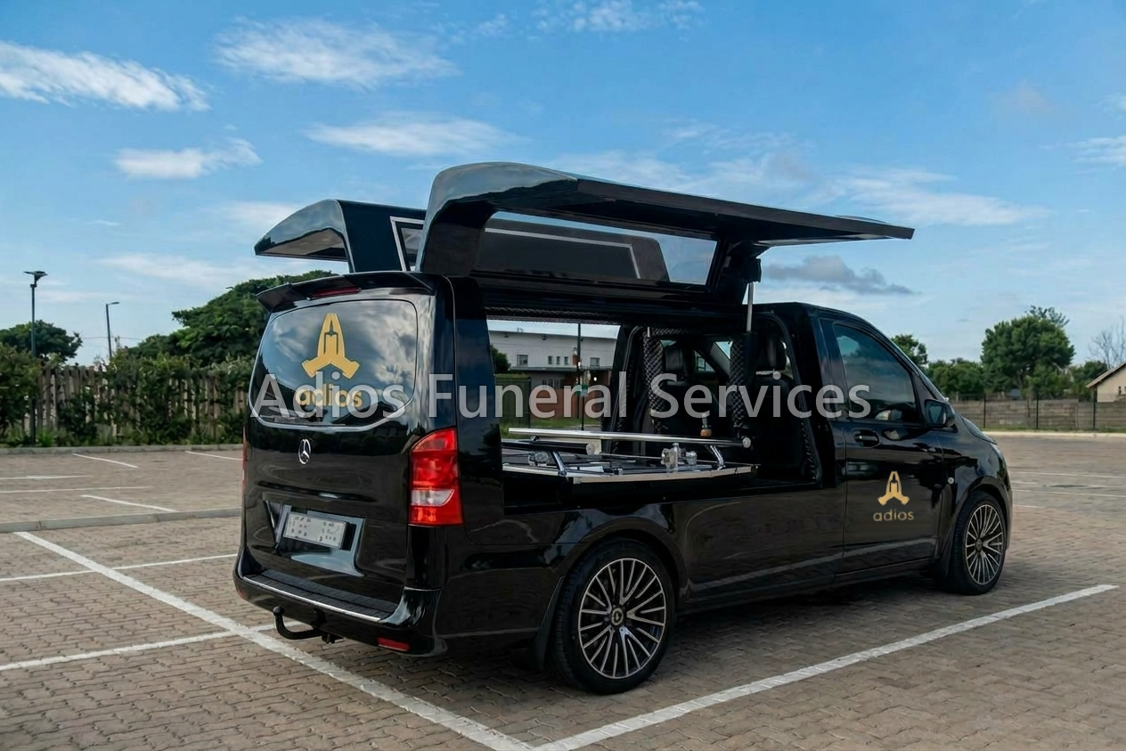 Adios Funeral Services Mercedes-Benz hearse with its casket canopy open